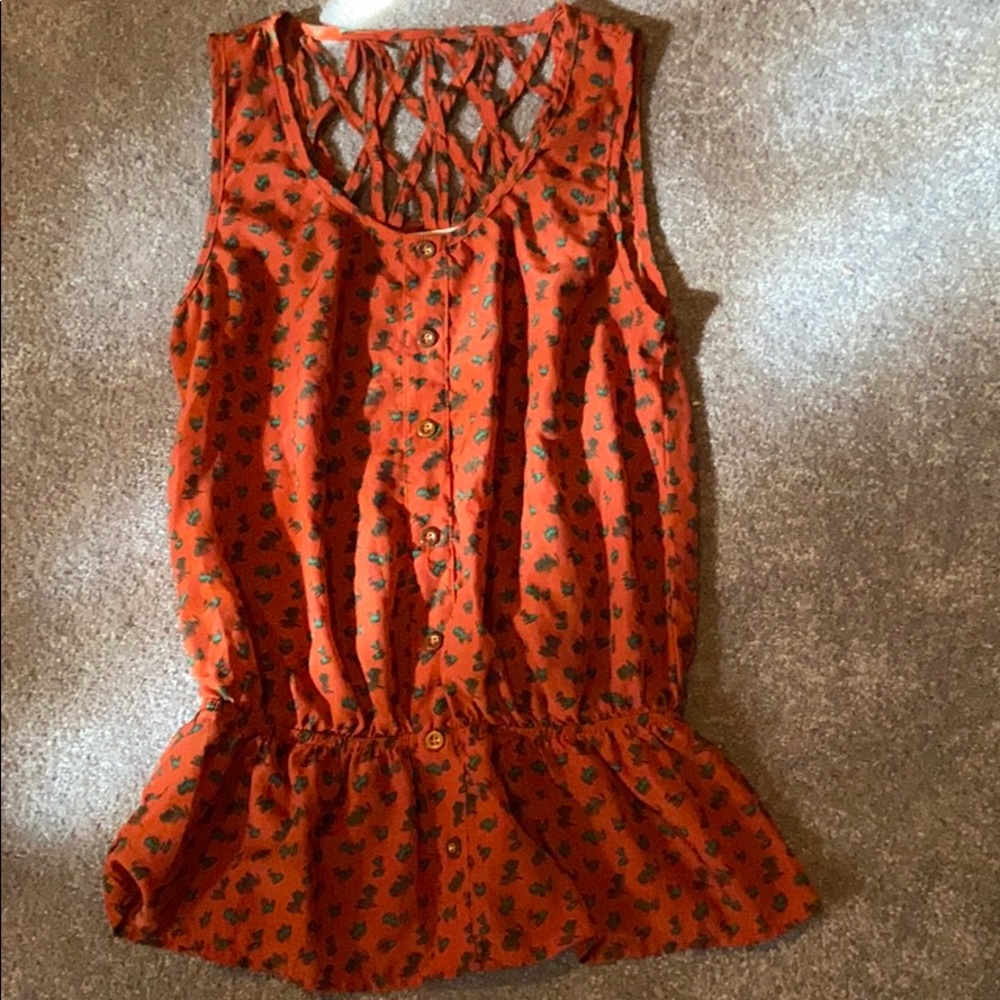 An abstract orange and green blouse